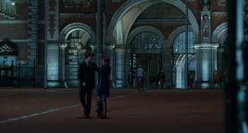 Movie still from “The Fault in Our Stars” (2014), directed by Josh Boone – A man and a woman standing next to each other on the street; Extreme Wide shot, Low angle