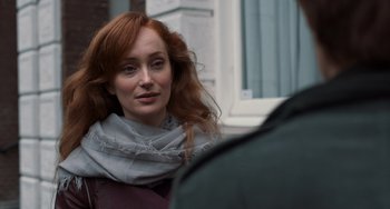 Movie still from “The Fault in Our Stars” (2014), directed by Josh Boone – A woman with red hair wearing a gray scarf; Close Up shot, Over the shoulder angle