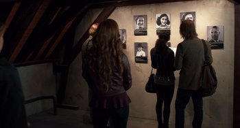 Movie still from “The Fault in Our Stars” (2014), directed by Josh Boone – A group of people standing in front of a wall; Medium shot, High angle