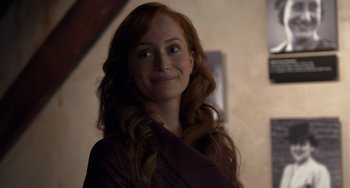 Movie still from “The Fault in Our Stars” (2014), directed by Josh Boone – A woman with long red hair smiling for the camera; Close Up shot, Over the shoulder angle