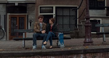 Movie still from “The Fault in Our Stars” (2014), directed by Josh Boone – A man and a woman sitting on a bench; Wide shot, Low angle