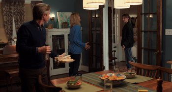Movie still from “The Fault in Our Stars” (2014), directed by Josh Boone – A group of people standing around a table; Wide shot, Over the shoulder angle