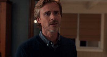 Movie still from “The Fault in Our Stars” (2014), directed by Josh Boone – A person with long hair and a beard; Close Up shot, Over the shoulder angle