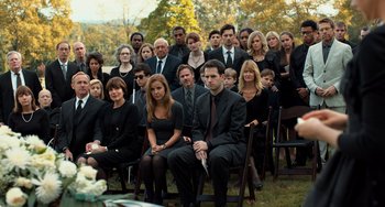 Movie still from “The Fault in Our Stars” (2014), directed by Josh Boone – A group of people in suits and ties sitting in chairs in a field; Wide shot, High angle
