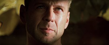 Movie still from “The Fifth Element” (1997), directed by Luc Besson – A man's face in the sunlight; Close Up shot, Low angle