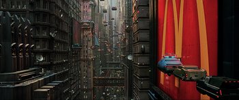 Movie still from “The Fifth Element” (1997), directed by Luc Besson – An image of a city with a lot of cars on the street; Extreme Wide shot, Overhead angle