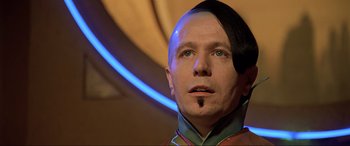 Movie still from “The Fifth Element” (1997), directed by Luc Besson – A person wearing a helmet; Close Up shot, Low angle
