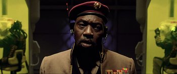 Movie still from “The Fifth Element” (1997), directed by Luc Besson – A person wearing headphones and a hat; Close Up shot, Low angle