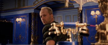 Movie still from “The Fifth Element” (1997), directed by Luc Besson – A person wearing a black jacket; Medium shot, Over the shoulder angle