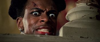 Movie still from “The Fifth Element” (1997), directed by Luc Besson – A person's face with blood on his face; Extreme Close Up shot, Low angle