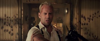 Movie still from “The Fifth Element” (1997), directed by Luc Besson – A person with a knife on his arm; Close Up shot, Over the shoulder angle