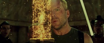Movie still from “The Fifth Element” (1997), directed by Luc Besson – A person looking at a cake; Close Up shot, Low angle
