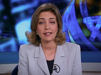 Movie still from “The Figo Affair: The Transfer that Changed Football” (2022), directed by Ben Nicholas – A woman is sitting in front of a camera; Close Up shot, Low angle