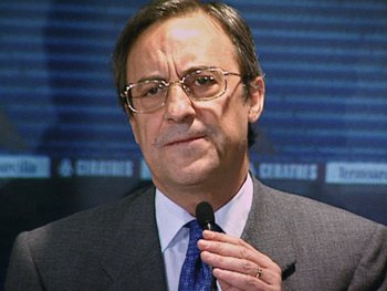 Movie still from “The Figo Affair: The Transfer that Changed Football” (2022), directed by Ben Nicholas – A person wearing a suit and tie; Close Up shot, Low angle