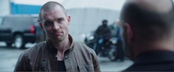 Movie still from “Deadpool” (2016), directed by Tim Miller – A person wearing a leather jacket; Close Up shot, Over the shoulder angle
