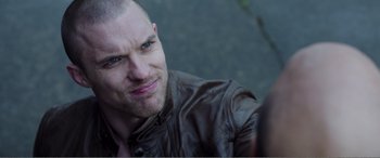 Movie still from “Deadpool” (2016), directed by Tim Miller – A person wearing a leather jacket; Close Up shot, Over the shoulder angle