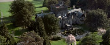 Movie still from “Deadpool” (2016), directed by Tim Miller – An aerial view of an old mansion with a garden; Extreme Wide shot, High angle