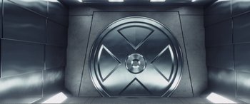 Movie still from “Deadpool” (2016), directed by Tim Miller – A metal sign with a symbol on it; Extreme Close Up shot, Overhead angle