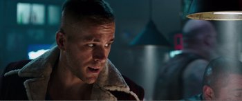 Movie still from “Deadpool” (2016), directed by Tim Miller – A person wearing a robe; Close Up shot, Over the shoulder angle