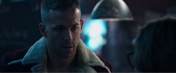 Movie still from “Deadpool” (2016), directed by Tim Miller – A person wearing a jacket; Close Up shot, Over the shoulder angle