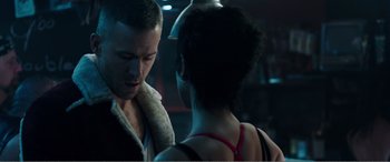 Movie still from “Deadpool” (2016), directed by Tim Miller – A man and a woman standing next to each other in a room; Close Up shot, Over the shoulder angle