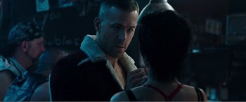 Movie still from “Deadpool” (2016), directed by Tim Miller – A man and a woman are talking in a dark room; Close Up shot, Over the shoulder angle