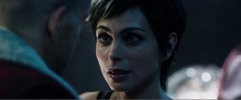 Movie still from “Deadpool” (2016), directed by Tim Miller – A person with short hair; Close Up shot, Over the shoulder angle