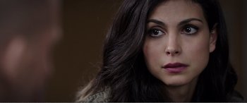 Movie still from “Deadpool” (2016), directed by Tim Miller – A woman's face with long dark hair; Close Up shot, Over the shoulder angle