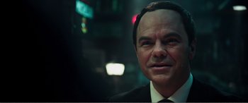 Movie still from “Deadpool” (2016), directed by Tim Miller – A person wearing a suit and tie; Close Up shot, Over the shoulder angle