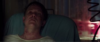 Movie still from “Deadpool” (2016), directed by Tim Miller – A man laying in a hospital bed looking up at the ceiling; Close Up shot, High angle