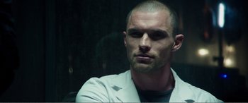 Movie still from “Deadpool” (2016), directed by Tim Miller – A person wearing a white shirt; Close Up shot, Low angle