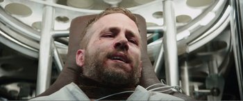 Movie still from “Deadpool” (2016), directed by Tim Miller – A person in a dentist's chair; Close Up shot, Overhead angle