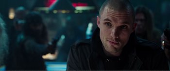 Movie still from “Deadpool” (2016), directed by Tim Miller – A person sitting in a room; Close Up shot, Low angle