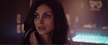 Movie still from “Deadpool” (2016), directed by Tim Miller – A beautiful woman with long dark brown hair; Close Up shot, Low angle