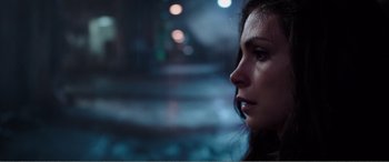 Movie still from “Deadpool” (2016), directed by Tim Miller – A person looking out a window at night; Close Up shot, Over the shoulder angle