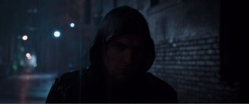 Movie still from “Deadpool” (2016), directed by Tim Miller – A man in a hooded jacket looking at the camera; Close Up shot, Low angle