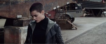 Movie still from “Deadpool” (2016), directed by Tim Miller – A person with a black leather jacket and a black jacket; Close Up shot, Low angle