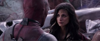 Movie still from “Deadpool” (2016), directed by Tim Miller – A woman and a man that are talking to each other; Close Up shot, Over the shoulder angle