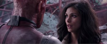 Movie still from “Deadpool” (2016), directed by Tim Miller – A man and a woman face each other in a room; Close Up shot, Over the shoulder angle