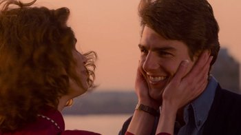 Movie still from “The Firm” (1993), directed by Sydney Pollack – A man and a woman smiling at each other; Close Up shot, Over the shoulder angle