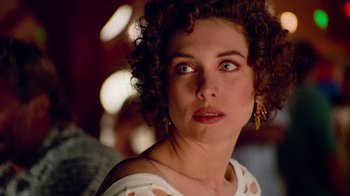 Movie still from “The Firm” (1993), directed by Sydney Pollack – A person looking at the camera; Close Up shot, Over the shoulder angle