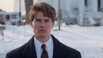 Movie still from “The Firm” (1993), directed by Sydney Pollack – A person wearing a suit and tie; Close Up shot, Low angle
