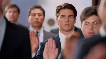 Movie still from “The Firm” (1993), directed by Sydney Pollack – A group of men in suits are taking the oath of allegiance; Close Up shot, Over the shoulder angle