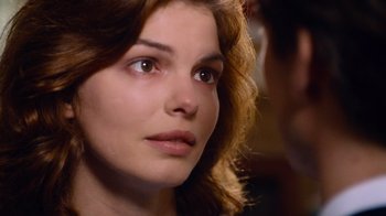 Movie still from “The Firm” (1993), directed by Sydney Pollack – A woman's face as she stares into the distance; Close Up shot, Over the shoulder angle