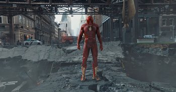 Movie still from “The Flash” (2023), directed by Andy Muschietti – A man standing in the middle of a street; Wide shot, Low angle
