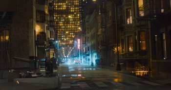 Movie still from “The Flash” (2023), directed by Andy Muschietti – A city at night lit up by street lights; Extreme Wide shot, Low angle