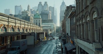 Movie still from “The Flash” (2023), directed by Andy Muschietti – A city street filled with lots of buildings; Extreme Wide shot, High angle