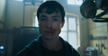 Movie still from “The Flash” (2023), directed by Andy Muschietti – A young man with blood on his face; Close Up shot, Low angle