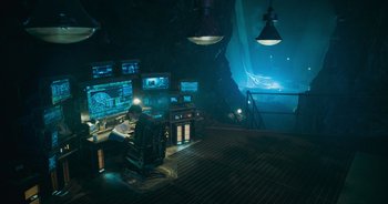 Movie still from “The Flash” (2023), directed by Andy Muschietti – A man sitting at a computer desk in a room; Wide shot, High angle