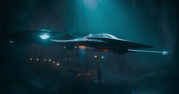 Movie still from “The Flash” (2023), directed by Andy Muschietti – A fighter jet flying through the air at night; Extreme Wide shot, High angle